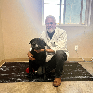 Dr. Garten with a black dog