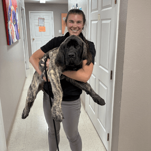 Dr. Henslee holding a dog